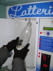 Filling a bottle with the milk machine